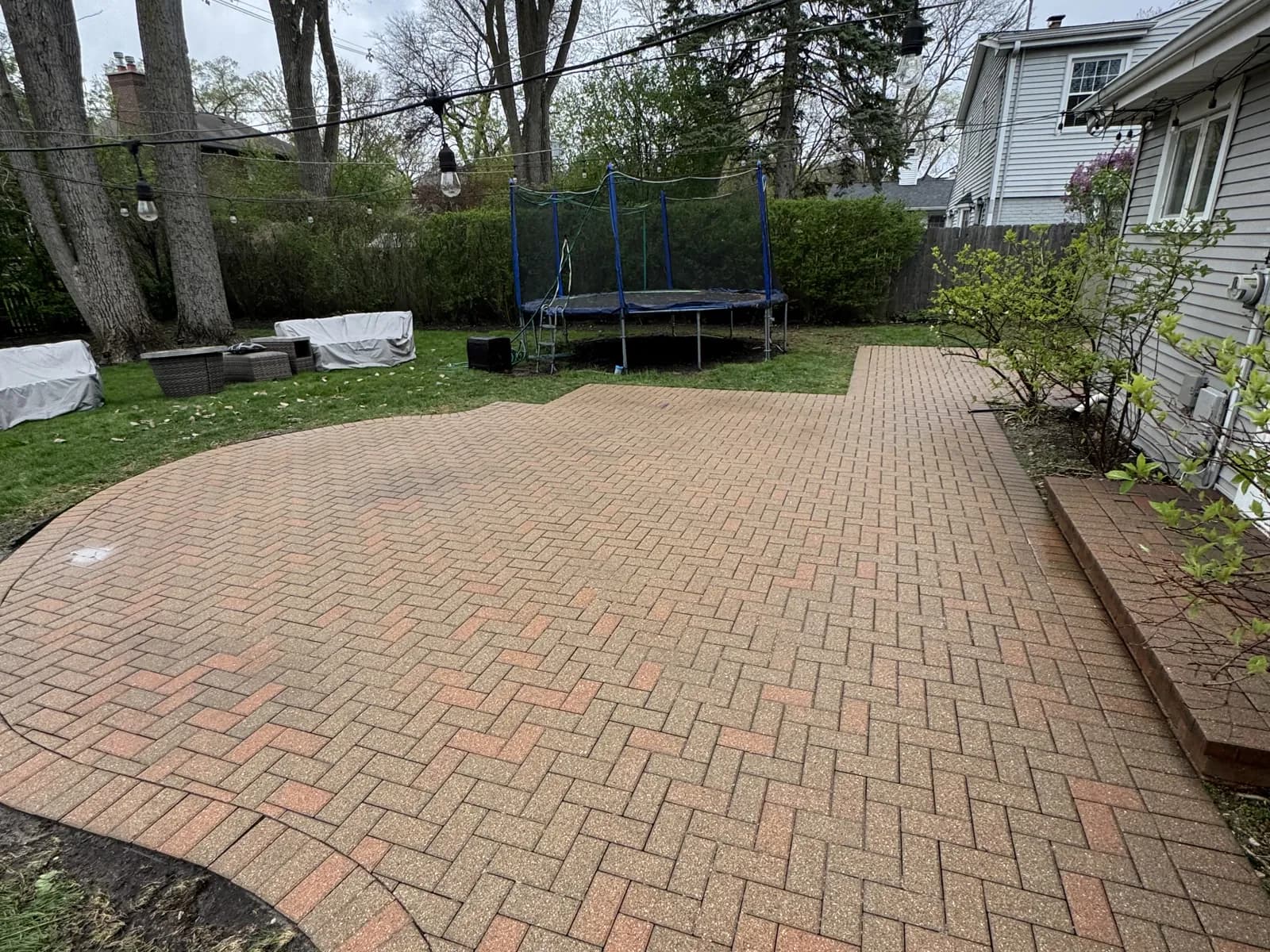 A herringbone paver patio after cleaning