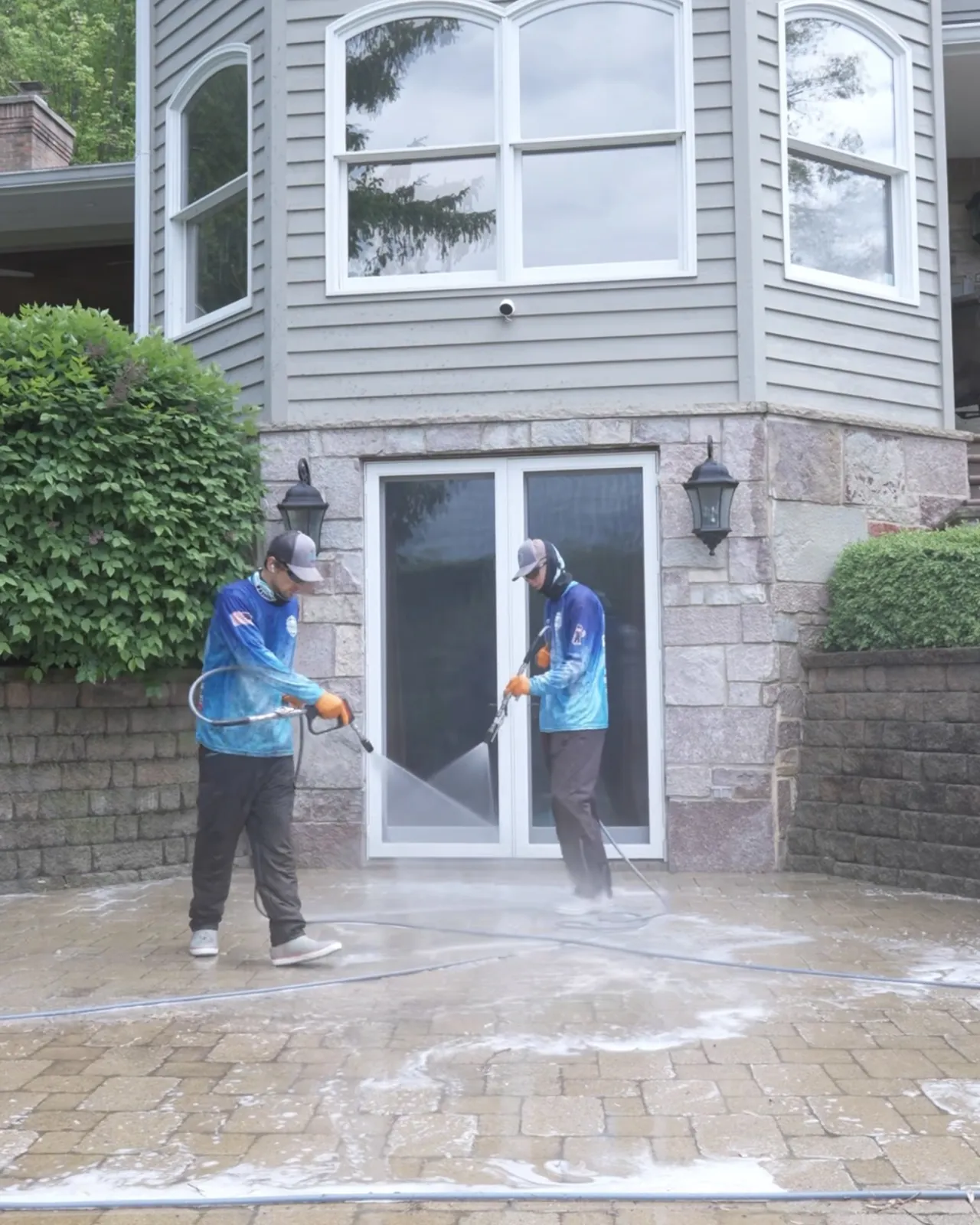Two crew on a paver terrace