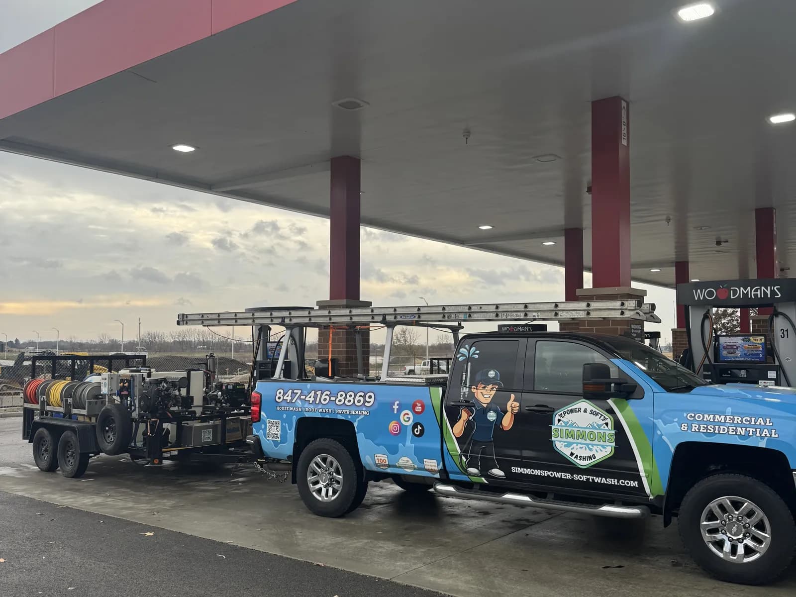 Our truck and rig under a gas station canopy