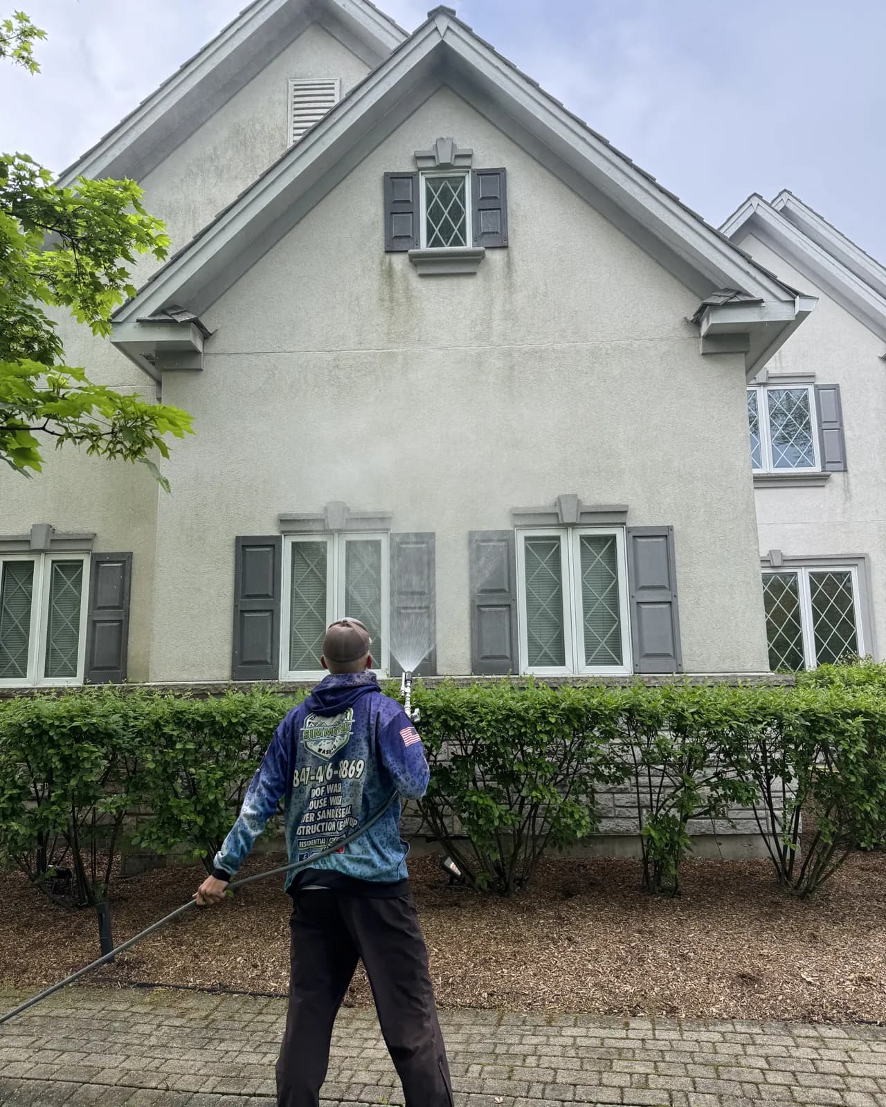 Soft washing a stucco home