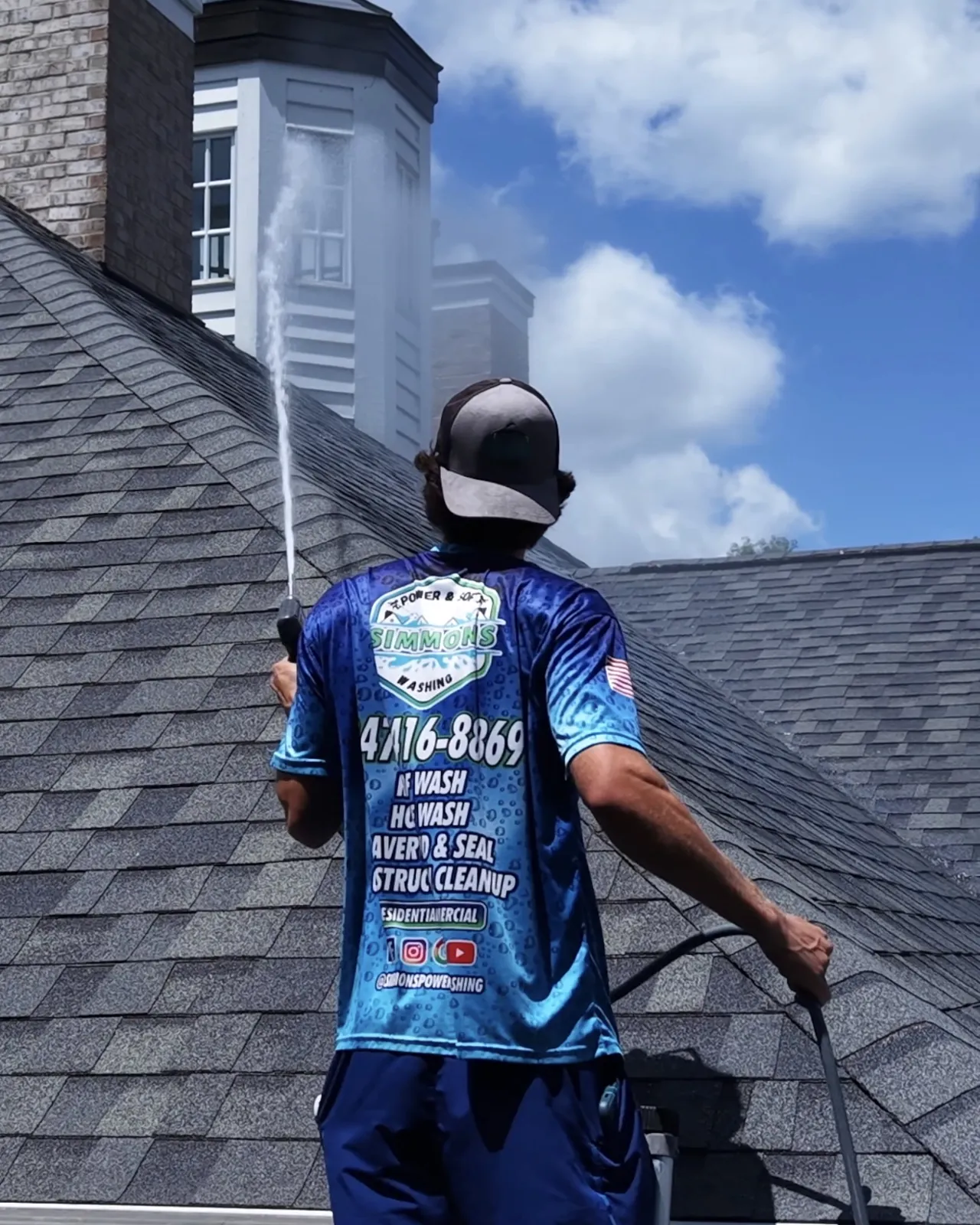 Soft washing an asphalt roof
