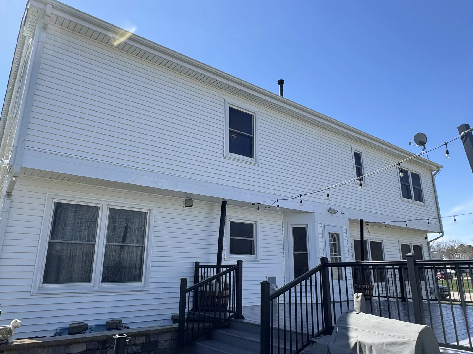 Back of a white two-story home